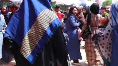 Unidentified people at a market in Kabul, the capital of Afghanistan, circa May 2019