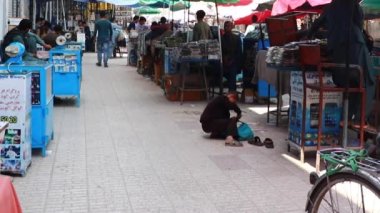 Unidentified people at a market in Kabul, the capital of Afghanistan, circa May 2019