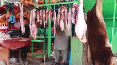 Unidentified people at  meat market in Kabul, the capital of Afghanistan, circa May 2019