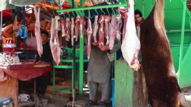 Unidentified people at  meat market in Kabul, the capital of Afghanistan, circa May 2019