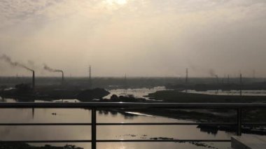 Sunset over the Buriganga River in the Southwest outskirts of Dhaka, the capital of Bangladesh