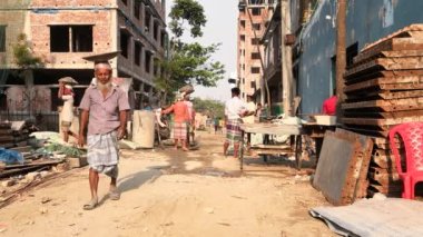 Unidentified people working at a construction site at the Chandrima Housing Society in Dhaka, the capital of Bangladesh, circa March 2020