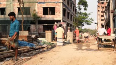Unidentified people working at a construction site at the Chandrima Housing Society in Dhaka, the capital of Bangladesh, circa March 2020