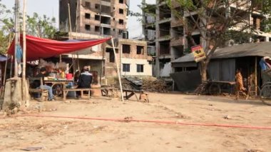 Unidentified people working at a construction site at the Chandrima Housing Society in Dhaka, the capital of Bangladesh, circa March 2020