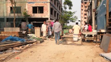 Unidentified people working at a construction site at the Chandrima Housing Society in Dhaka, the capital of Bangladesh, circa March 2020