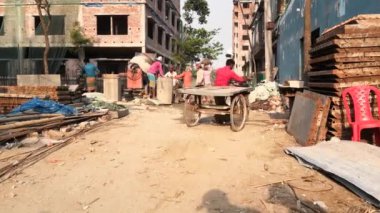 Unidentified people working at a construction site at the Chandrima Housing Society in Dhaka, the capital of Bangladesh, circa March 2020