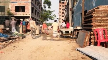 Unidentified people working at a construction site at the Chandrima Housing Society in Dhaka, the capital of Bangladesh, circa March 2020