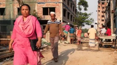 Unidentified people working at a construction site at the Chandrima Housing Society in Dhaka, the capital of Bangladesh, circa March 2020