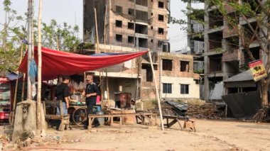 Unidentified people working at a construction site at the Chandrima Housing Society in Dhaka, the capital of Bangladesh, circa March 2020