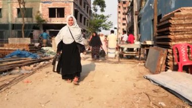 Unidentified people working at a construction site at the Chandrima Housing Society in Dhaka, the capital of Bangladesh, circa March 2020