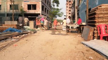 Unidentified people working at a construction site at the Chandrima Housing Society in Dhaka, the capital of Bangladesh, circa March 2020