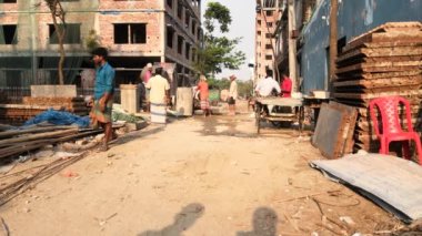 Unidentified people working at a construction site at the Chandrima Housing Society in Dhaka, the capital of Bangladesh, circa March 2020