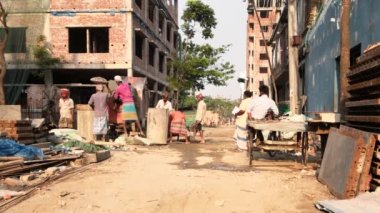 Unidentified people working at a construction site at the Chandrima Housing Society in Dhaka, the capital of Bangladesh, circa March 2020