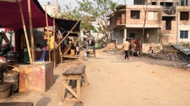 Unidentified people working at a construction site at the Chandrima Housing Society in Dhaka, the capital of Bangladesh, circa March 2020