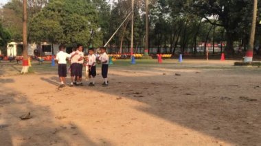Unidentified students playing cricket at the Dhaka Residential Model College in Mohammadpur, Dhaka, the capital of Bangladesh, circa March 2020