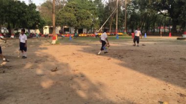 Unidentified students playing cricket at the Dhaka Residential Model College in Mohammadpur, Dhaka, the capital of Bangladesh, circa March 2020