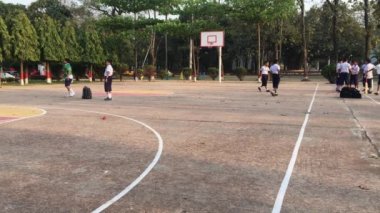 Unidentified students playing cricket at the Dhaka Residential Model College in Mohammadpur, Dhaka, the capital of Bangladesh, circa March 2020
