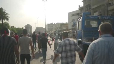 Unidentified people demonstrating against the Iraqi government at the 2019 Iraqi protests, also named Tishreen Revolution or Iraqi Intifada in Baghdad, 2019