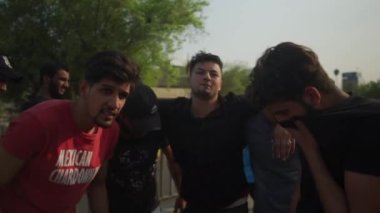 Unidentified people demonstrating against the Iraqi government at the 2019 Iraqi protests, also named Tishreen Revolution or Iraqi Intifada in Baghdad, 2019