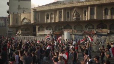 Unidentified people demonstrating against the Iraqi government at the 2019 Iraqi protests, also named Tishreen Revolution or Iraqi Intifada in Baghdad, 2019