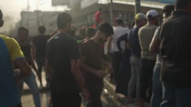 Unidentified people demonstrating against the Iraqi government at the 2019 Iraqi protests, also named Tishreen Revolution or Iraqi Intifada in Baghdad, 2019