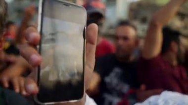 Unidentified people demonstrating against the Iraqi government at the 2019 Iraqi protests, also named Tishreen Revolution or Iraqi Intifada in Baghdad, 2019