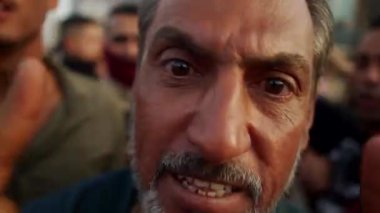 Unidentified people demonstrating against the Iraqi government at the 2019 Iraqi protests, also named Tishreen Revolution or Iraqi Intifada in Baghdad, 2019