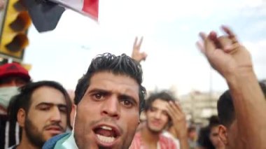 Unidentified people demonstrating against the Iraqi government at the 2019 Iraqi protests, also named Tishreen Revolution or Iraqi Intifada in Baghdad, 2019
