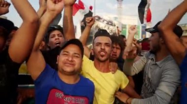 2019 'daki Irak protestolarında Irak hükümetine karşı gösteri yapan kimliği belirsiz kişiler, ayrıca 2019' da Bağdat 'ta Tishreen Devrimi veya Irak İntifadası olarak adlandırıldı.
