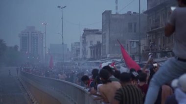 Unidentified people demonstrating against the Iraqi government at the 2019 Iraqi protests, also named Tishreen Revolution or Iraqi Intifada in Baghdad, 2019
