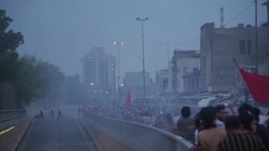 Unidentified people demonstrating against the Iraqi government at the 2019 Iraqi protests, also named Tishreen Revolution or Iraqi Intifada in Baghdad, 2019