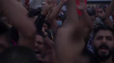 Unidentified people demonstrating against the Iraqi government at the 2019 Iraqi protests, also named Tishreen Revolution or Iraqi Intifada in Baghdad, 2019