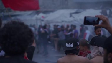 Unidentified people demonstrating against the Iraqi government at the 2019 Iraqi protests, also named Tishreen Revolution or Iraqi Intifada in Baghdad, 2019