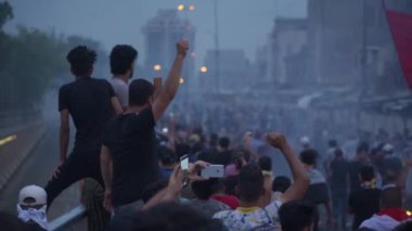 Unidentified people demonstrating against the Iraqi government at the 2019 Iraqi protests, also named Tishreen Revolution or Iraqi Intifada in Baghdad, 2019