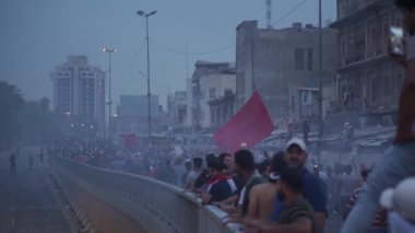 Unidentified people demonstrating against the Iraqi government at the 2019 Iraqi protests, also named Tishreen Revolution or Iraqi Intifada in Baghdad, 2019