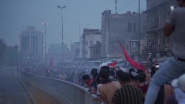 Unidentified people demonstrating against the Iraqi government at the 2019 Iraqi protests, also named Tishreen Revolution or Iraqi Intifada in Baghdad, 2019