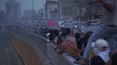 Unidentified people demonstrating against the Iraqi government at the 2019 Iraqi protests, also named Tishreen Revolution or Iraqi Intifada in Baghdad, 2019