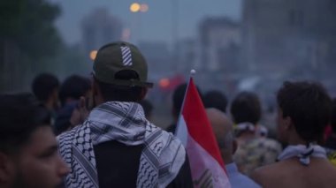 Unidentified people demonstrating against the Iraqi government at the 2019 Iraqi protests, also named Tishreen Revolution or Iraqi Intifada in Baghdad, 2019