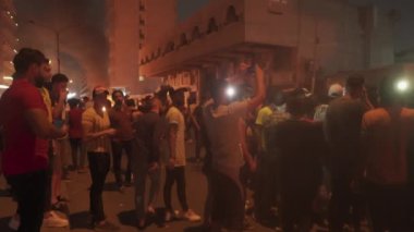 Unidentified people demonstrating against the Iraqi government at the 2019 Iraqi protests, also named Tishreen Revolution or Iraqi Intifada in Baghdad, 2019