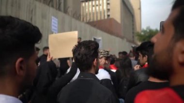 Unidentified people demonstrating against the Iraqi government at the 2019 Iraqi protests, also named Tishreen Revolution or Iraqi Intifada in Baghdad, 2019