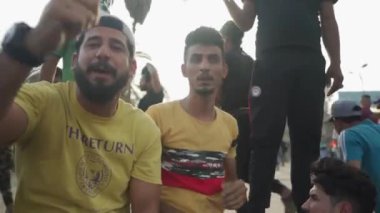 Unidentified people demonstrating against the Iraqi government at the 2019 Iraqi protests, also named Tishreen Revolution or Iraqi Intifada in Baghdad, 2019