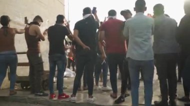 Unidentified people demonstrating against the Iraqi government at the 2019 Iraqi protests, also named Tishreen Revolution or Iraqi Intifada in Baghdad, 2019