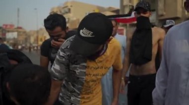 Unidentified people demonstrating against the Iraqi government at the 2019 Iraqi protests, also named Tishreen Revolution or Iraqi Intifada in Baghdad, 2019