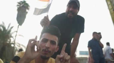 Unidentified people demonstrating against the Iraqi government at the 2019 Iraqi protests, also named Tishreen Revolution or Iraqi Intifada in Baghdad, 2019
