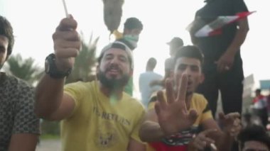 Unidentified people demonstrating against the Iraqi government at the 2019 Iraqi protests, also named Tishreen Revolution or Iraqi Intifada in Baghdad, 2019