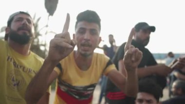 Unidentified people demonstrating against the Iraqi government at the 2019 Iraqi protests, also named Tishreen Revolution or Iraqi Intifada in Baghdad, 2019
