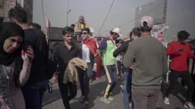 Unidentified people demonstrating against the Iraqi government at the 2019 Iraqi protests, also named Tishreen Revolution or Iraqi Intifada in Baghdad, 2019