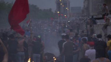 Unidentified people demonstrating against the Iraqi government at the 2019 Iraqi protests, also named Tishreen Revolution or Iraqi Intifada in Baghdad, 2019