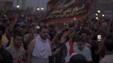 Unidentified people demonstrating against the Iraqi government at the 2019 Iraqi protests, also named Tishreen Revolution or Iraqi Intifada in Baghdad, 2019