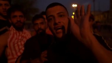 Unidentified people demonstrating against the Iraqi government at the 2019 Iraqi protests, also named Tishreen Revolution or Iraqi Intifada in Baghdad, 2019